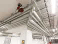 Wentylacja w obiektach budowlanych i przemysłowych. Jak zabezpieczać przewody instalacyjne?